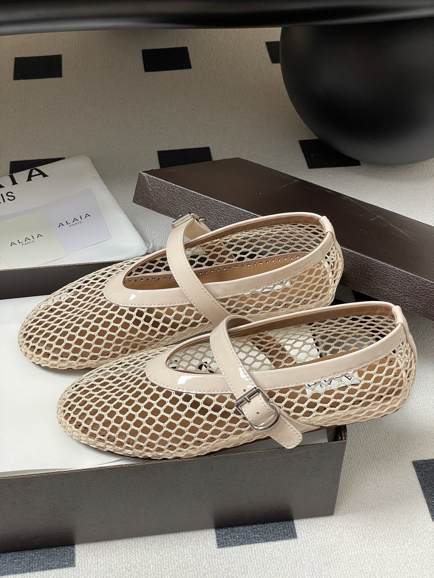 UA ALAÏA BALLET FLATS IN FISHNET
